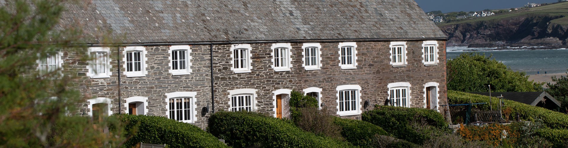 Old cottages looking out to sea in Cornwall, England.