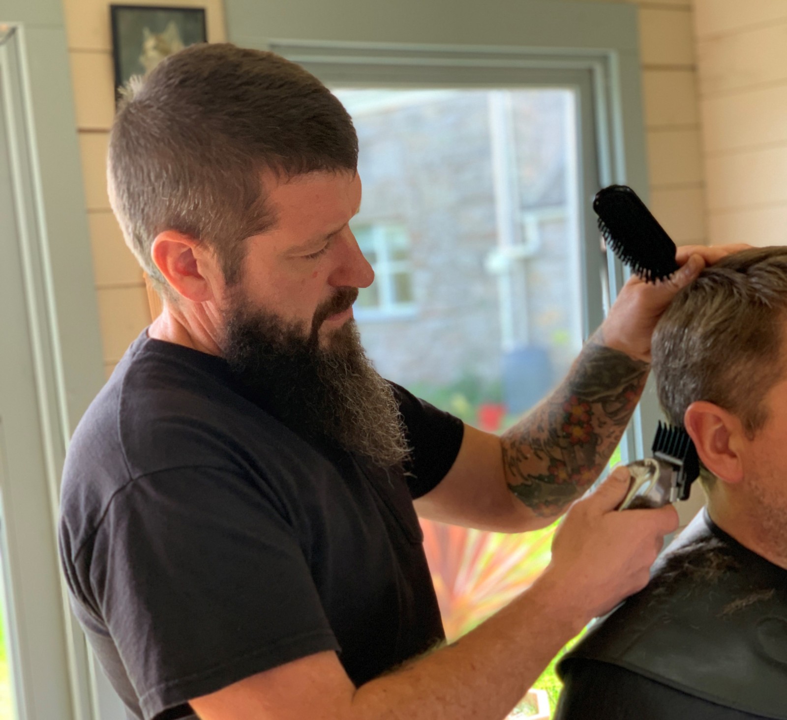 Barber cutting a man's hair